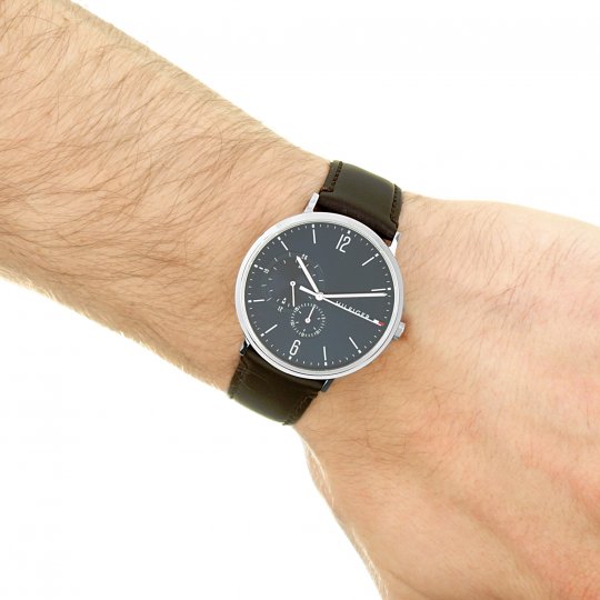 Tommy Hilfiger blue dial chronograph watch worn on wrist with brown leather strap