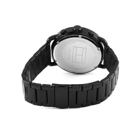 Tommy Hilfiger watch caseback showing stainless steel with brand engraving and black bracelet