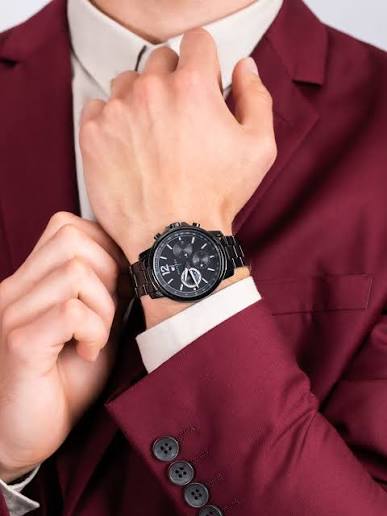 Tommy Hilfiger black dial chronograph watch worn on wrist