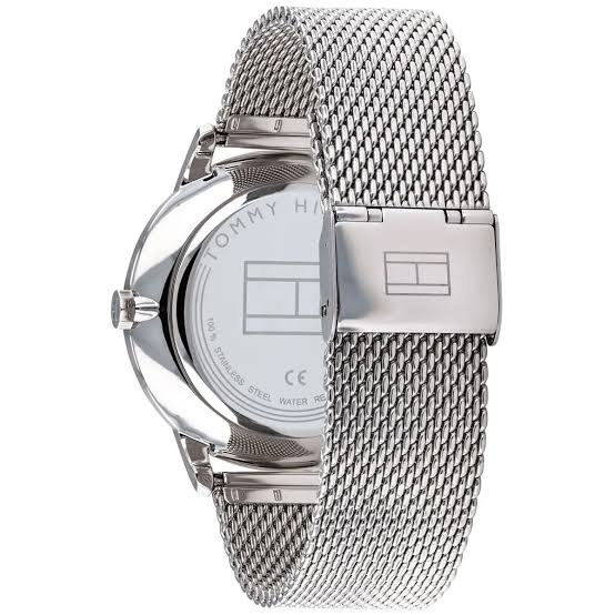 Tommy Hilfiger watch case back showing stainless steel construction and mesh strap