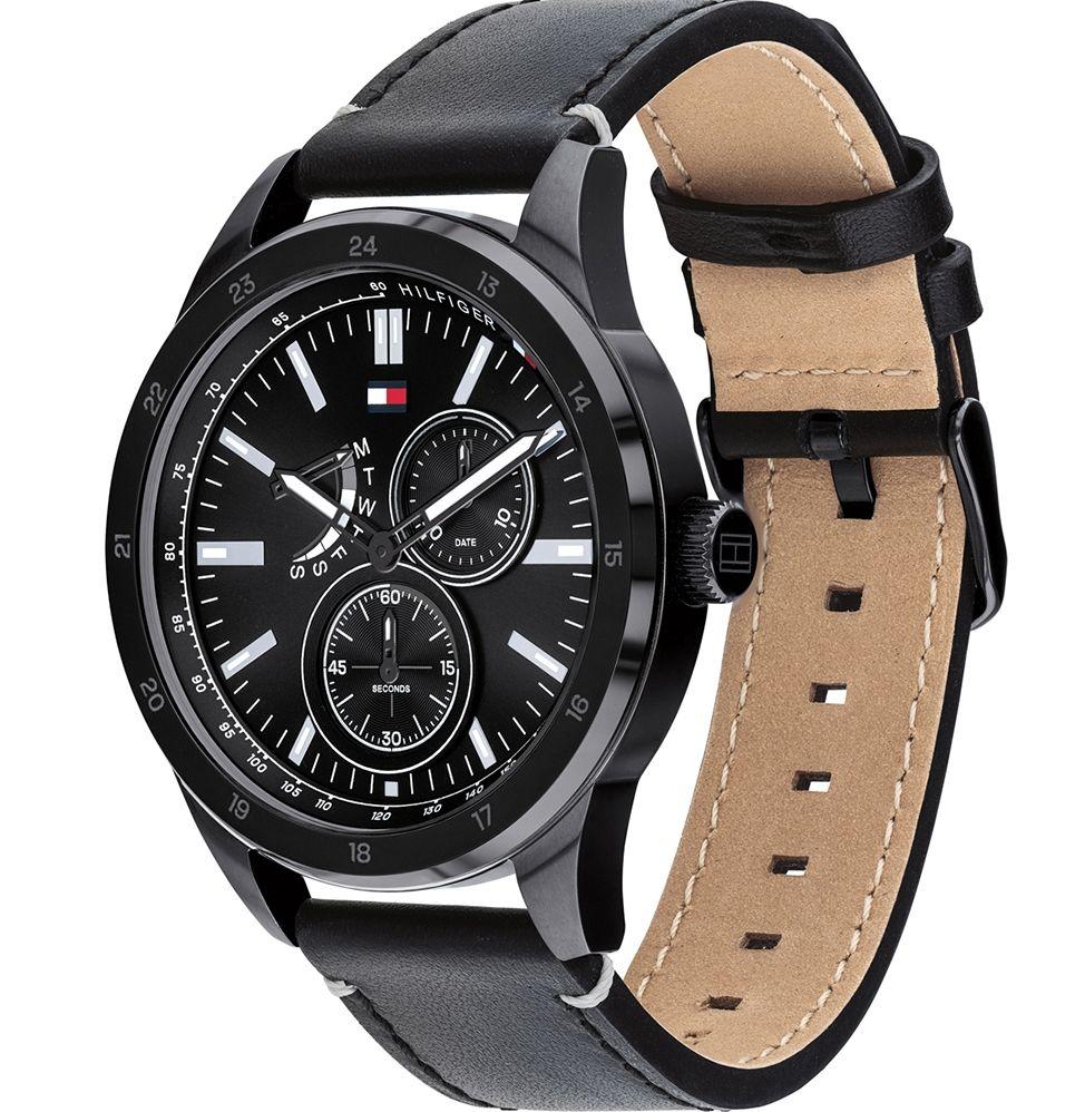 Tommy Hilfiger watch shown at angle revealing black leather strap with tan suede interior