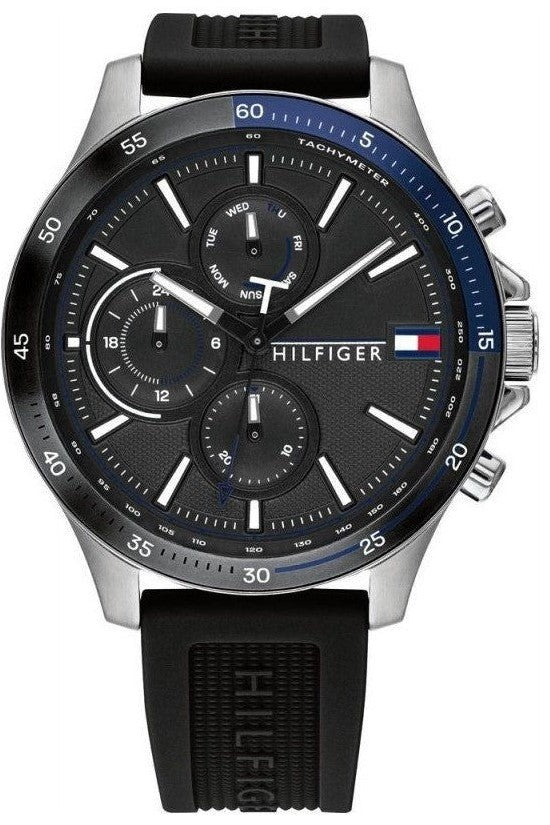 Tommy Hilfiger quartz watch with black dial, blue bezel, three subdials, and black rubber strap