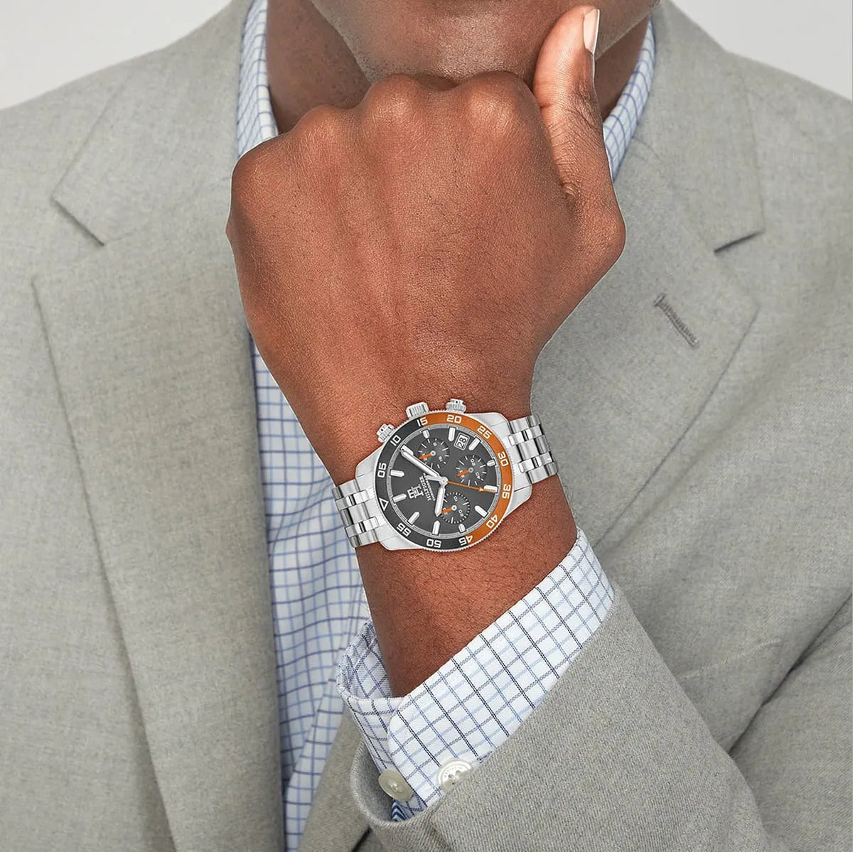 Tommy Hilfiger 1792186 chronograph men's watch with orange bezel worn on wrist
