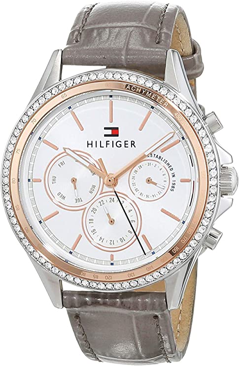 Side angle view of Tommy Hilfiger Ari chronograph watch showing rose gold bezel and grey leather strap