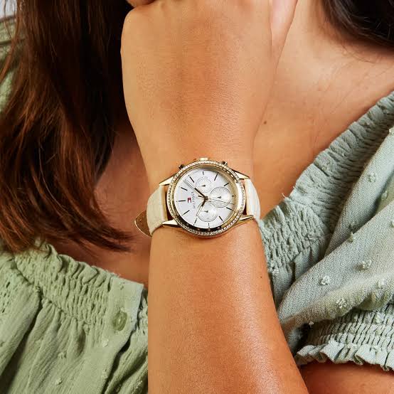 Tommy Hilfiger Ari chronograph watch worn on wrist with cream leather strap