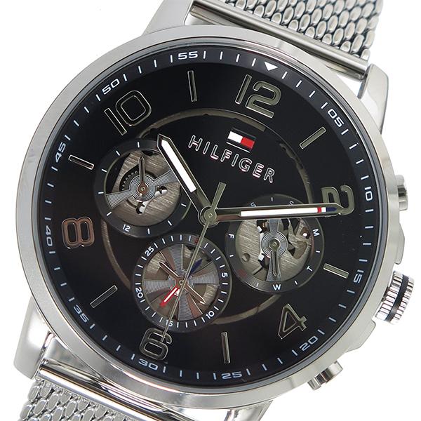 Close-up of black dial showing three open-worked subdials, hour markers, and HILFIGER branding