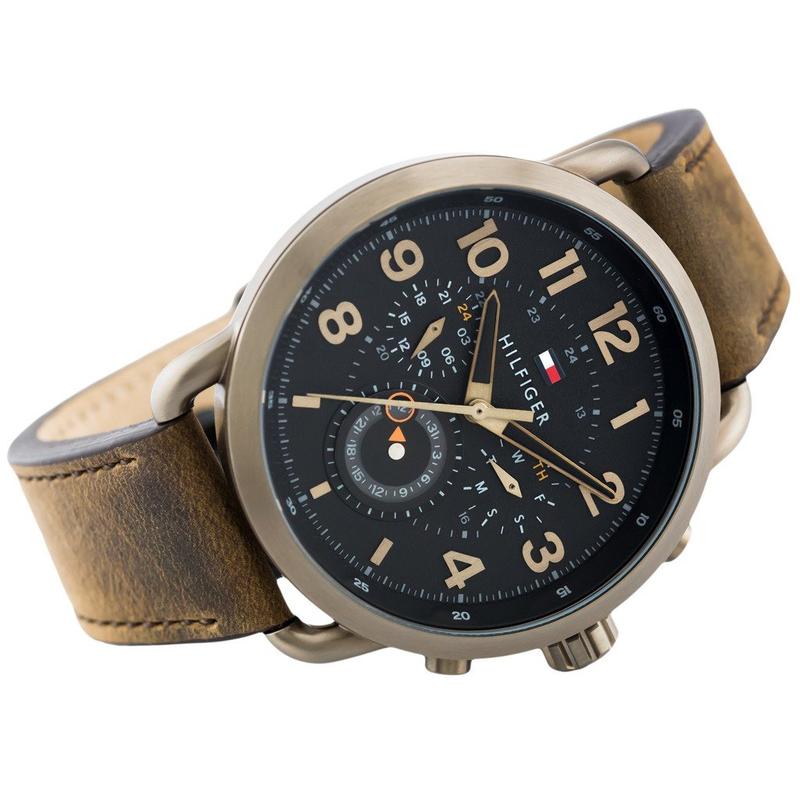 Side angle view of Tommy Hilfiger chronograph watch with brown leather strap and gunmetal case