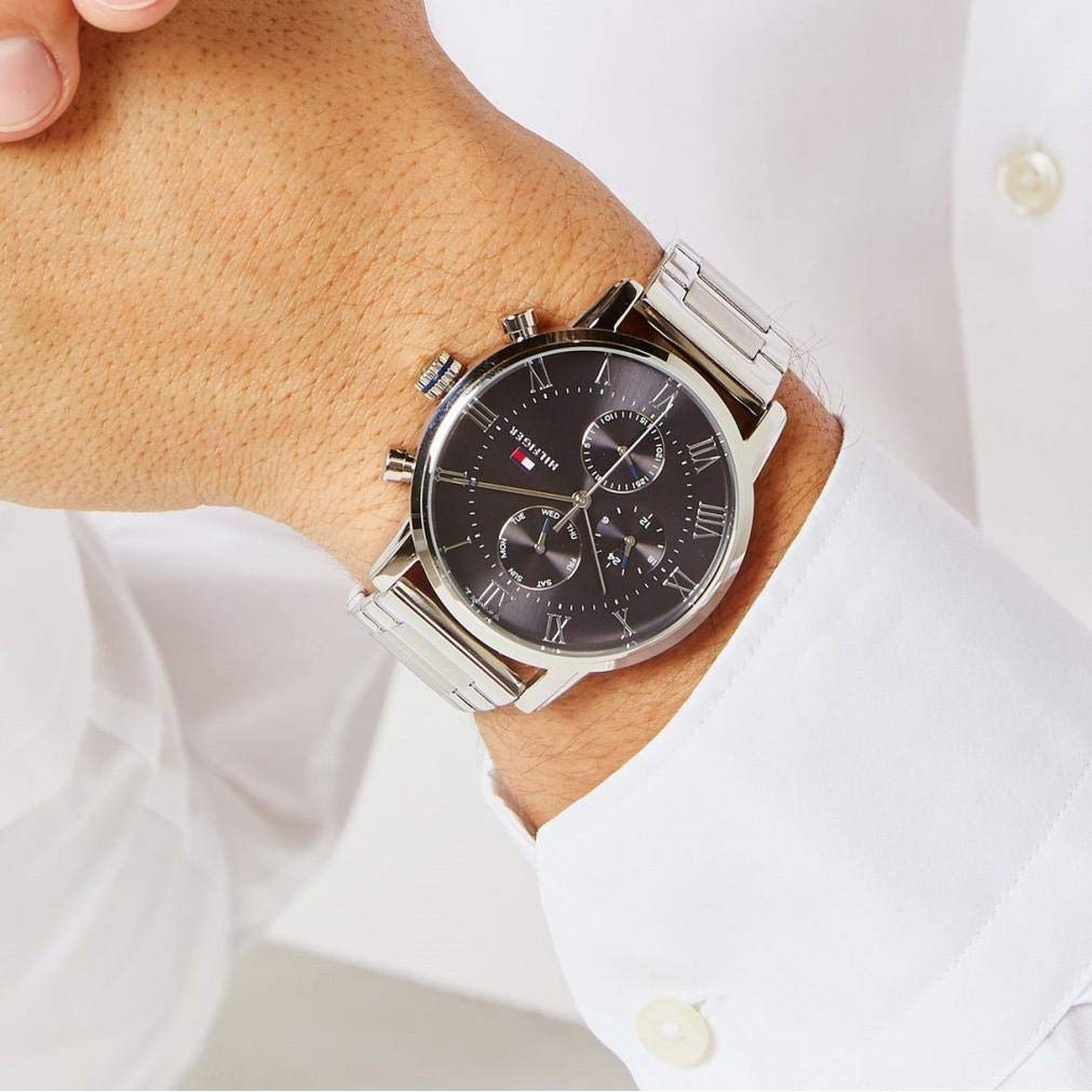 Tommy Hilfiger chronograph watch on wrist showing grey dial with Roman numerals