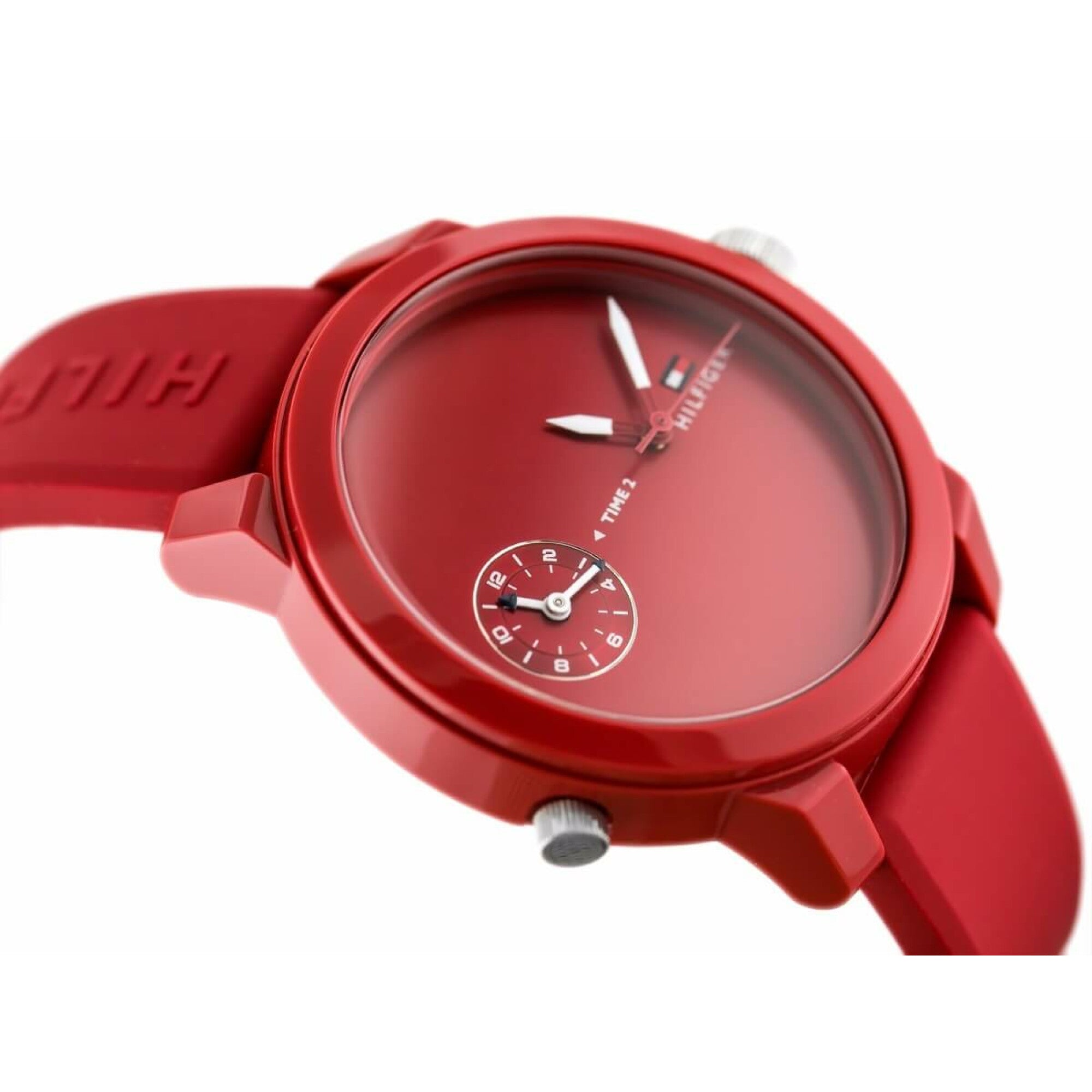 Close-up of red Tommy Hilfiger Denim Sport watch dial showing dual time zones and subdial