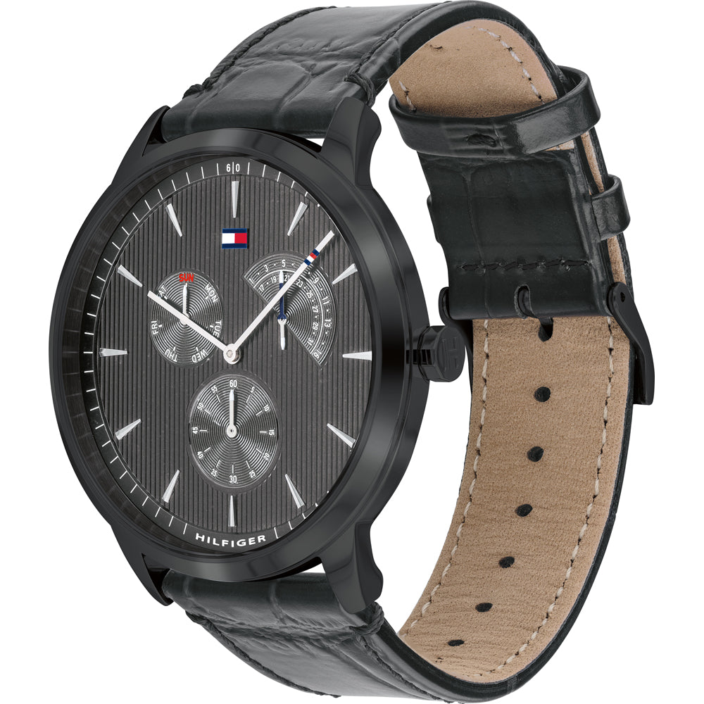 Tommy Hilfiger Dressed Up watch at angle showing black case and tan leather interior strap