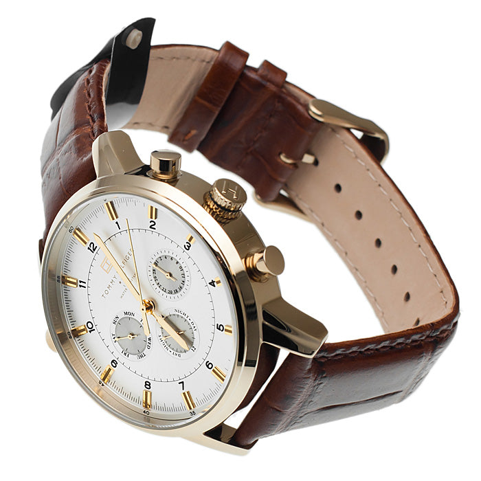 Side view of Tommy Hilfiger GMT watch with brown leather strap and gold-plated case