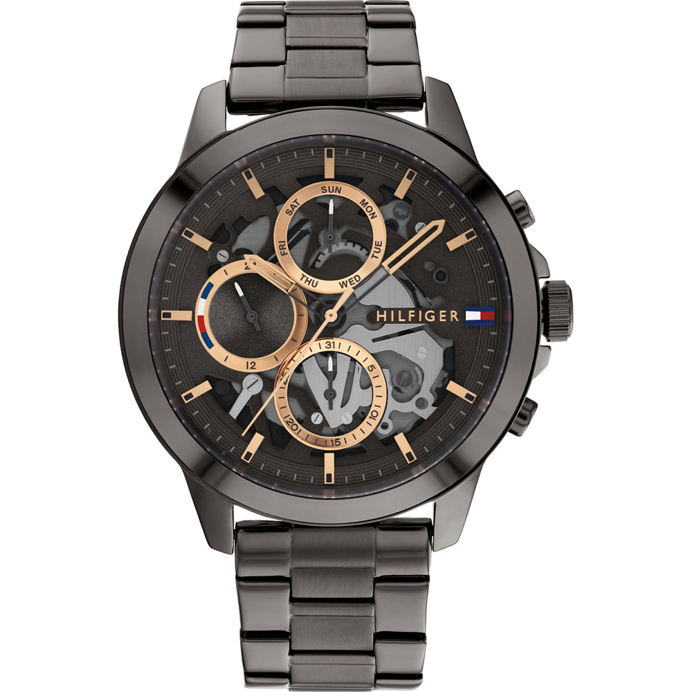 Tommy Hilfiger Henry watch angled view showing gunmetal grey stainless steel bracelet and dial