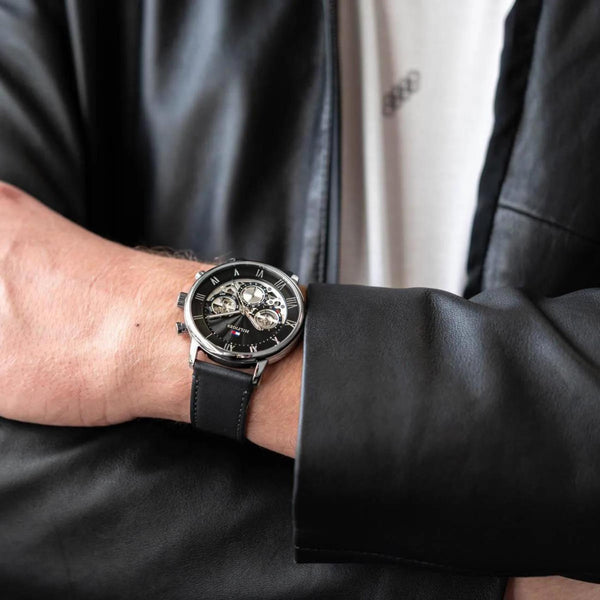 Tommy Hilfiger Legend chronograph worn on wrist with black dial and leather strap