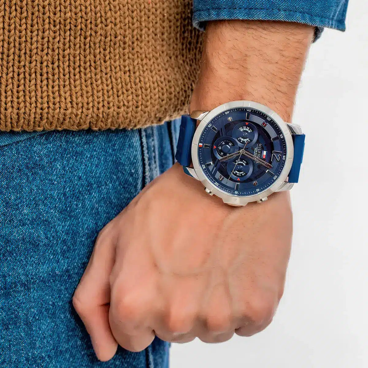 Tommy Hilfiger Luca chronograph watch on wrist with blue rubber strap