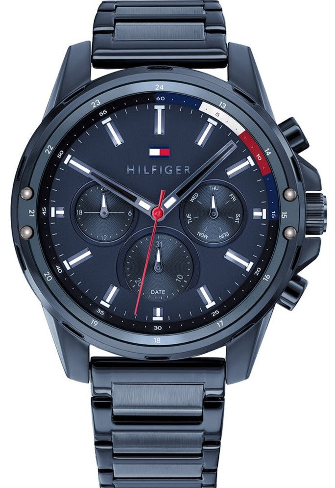 Tommy Hilfiger Mason chronograph watch with navy blue dial, stainless steel band, and red accents