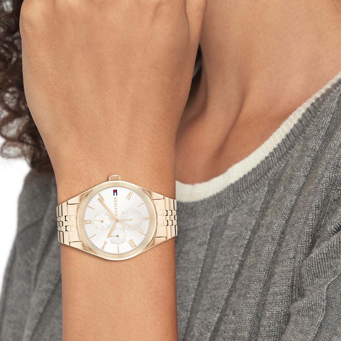 Tommy Hilfiger Monica ladies watch worn on wrist with silver dial and rose gold bracelet