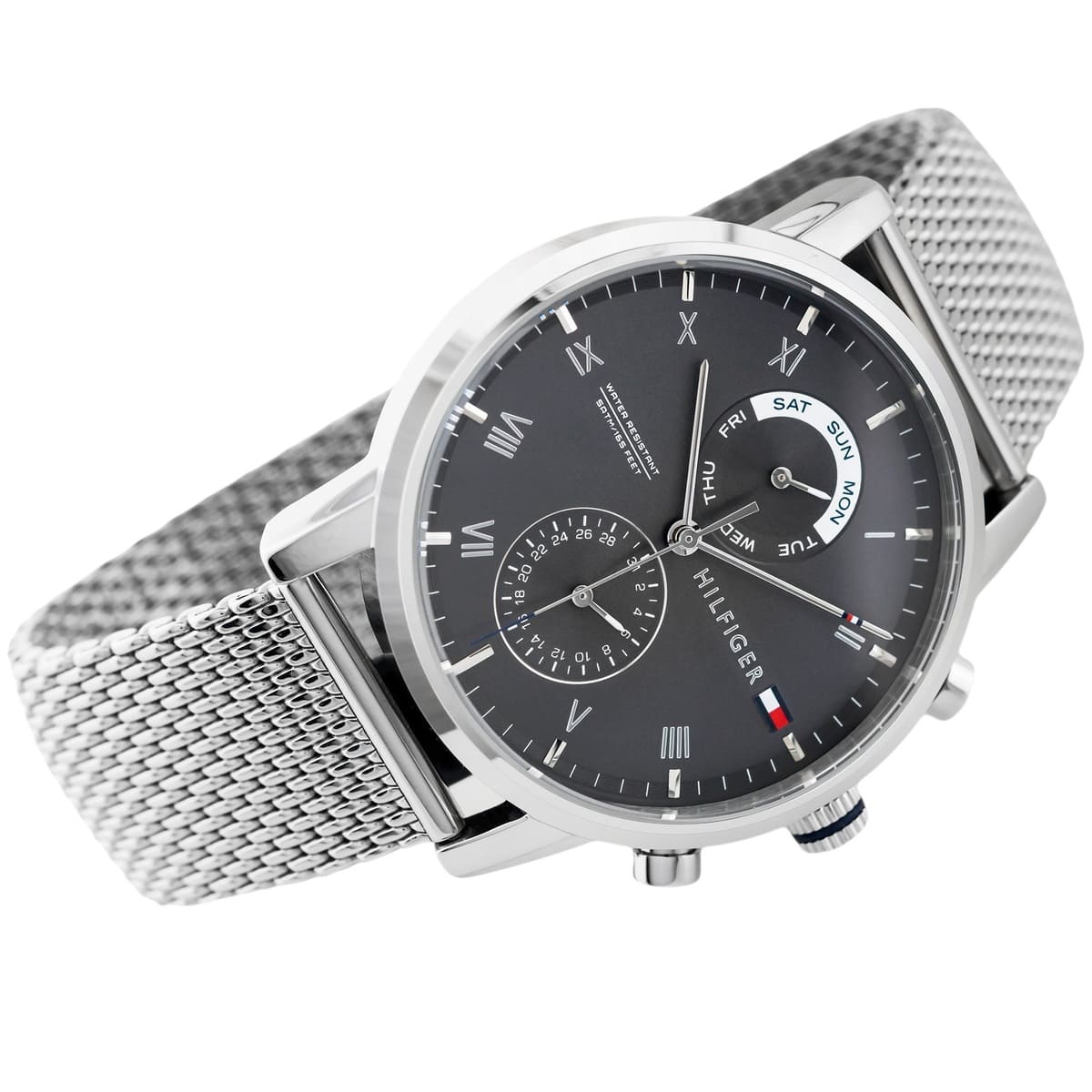 Tommy Hilfiger chronograph watch worn on wrist with gray mesh strap