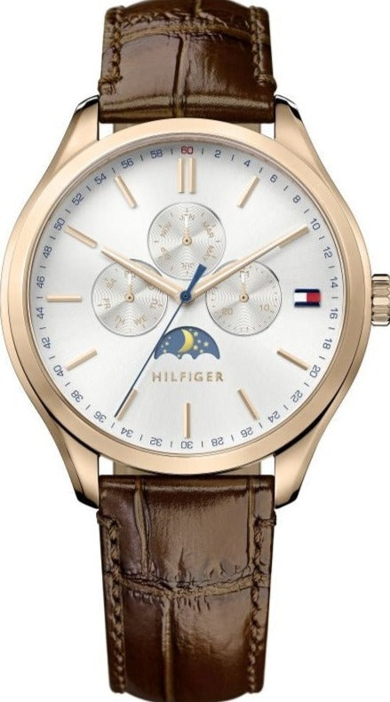 Tommy Hilfiger Oliver watch with rose gold case, white dial showing moon phase and subdials, brown leather strap