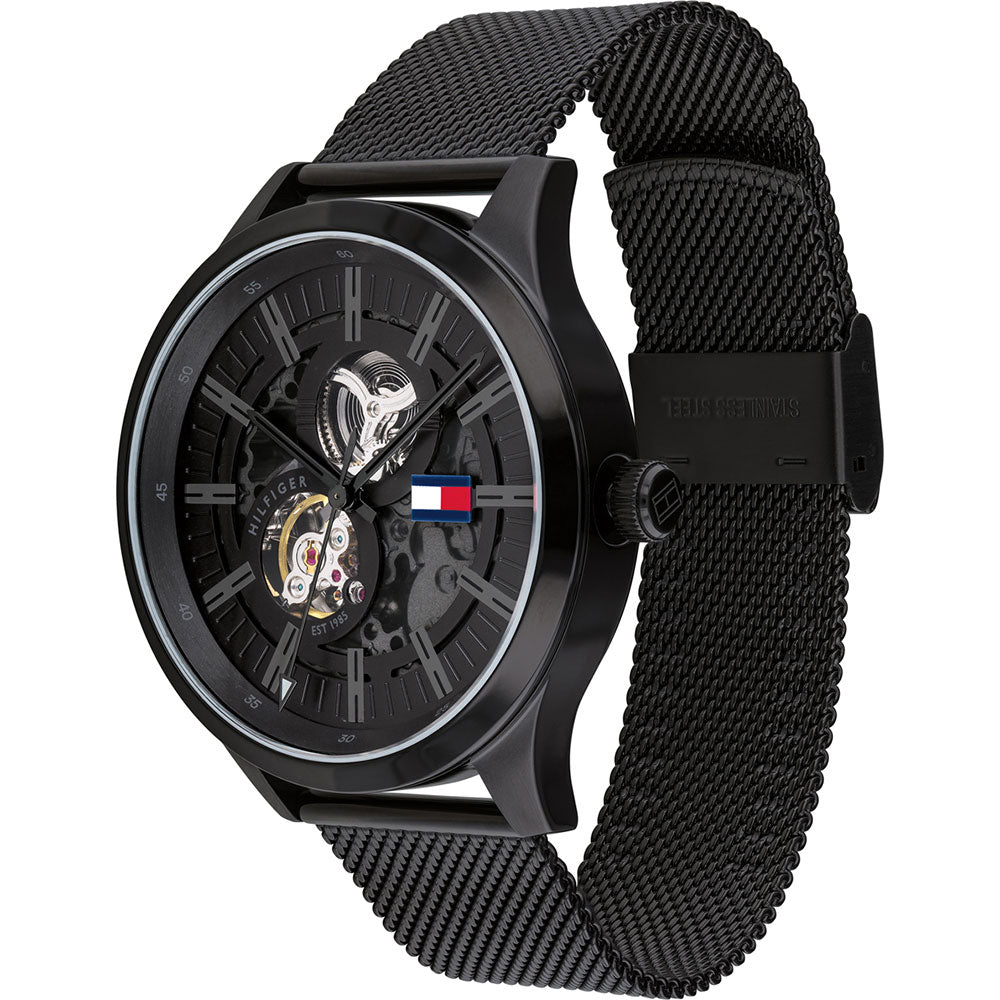Three-quarter angle view of Tommy Hilfiger Spencer skeleton watch with black mesh band