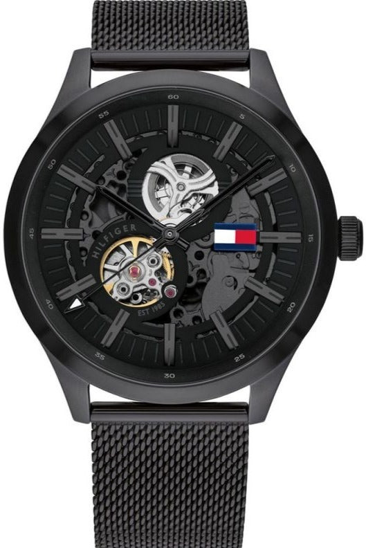 Tommy Hilfiger Spencer skeleton watch front view with black dial and mesh bracelet