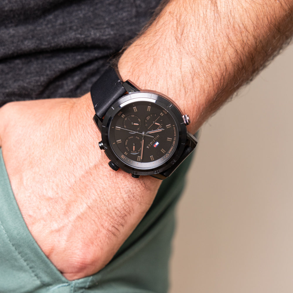 Tommy Hilfiger Troy chronograph watch on wrist showing black dial and rose gold hands
