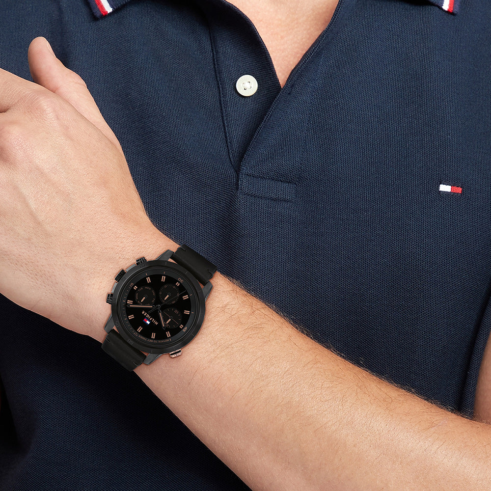 Tommy Hilfiger Troy men's chronograph watch worn on wrist with navy shirt