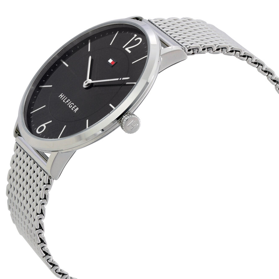 Tommy Hilfiger Ultra Slim watch at angle showing black dial and mesh band