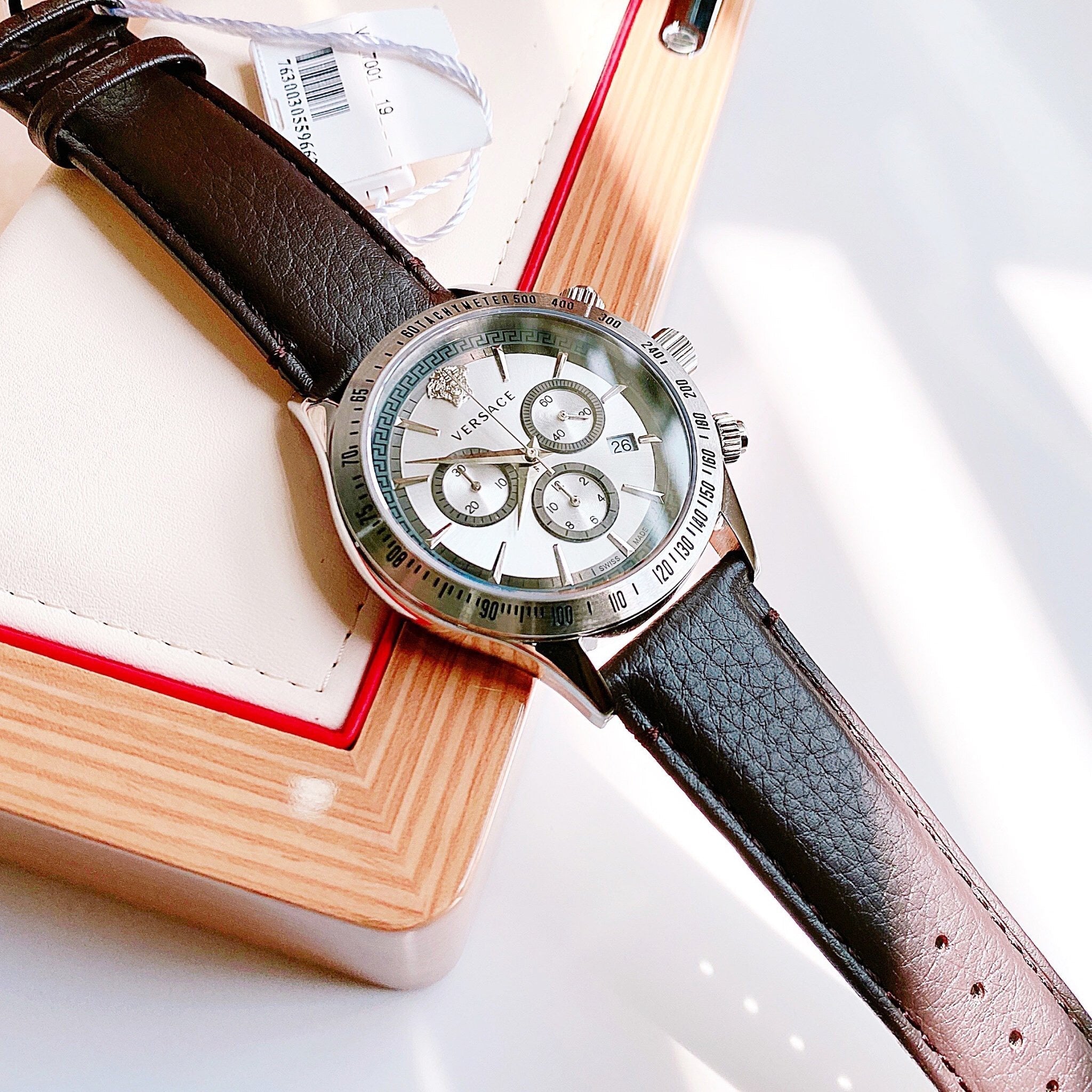 Versace Classic Chronograph watch on wrist showing silver dial with chronograph subdials
