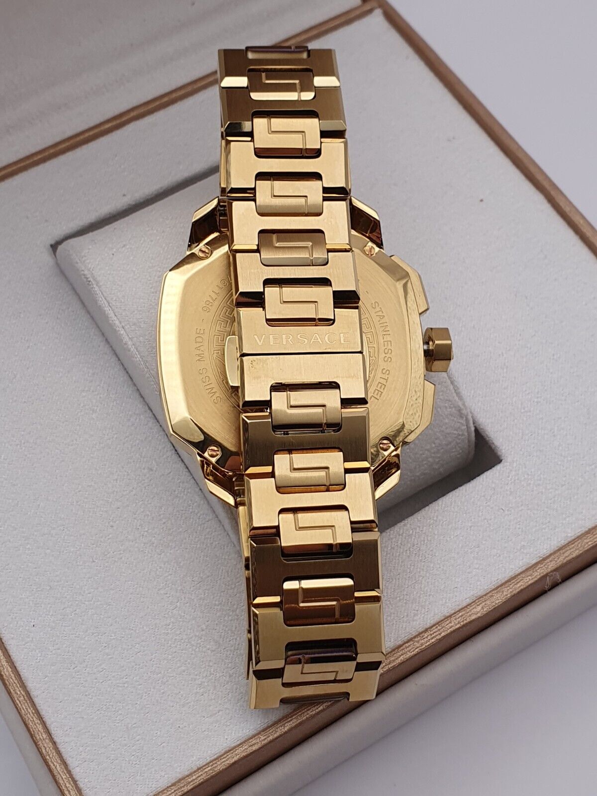 Versace Dylos gold steel bracelet strap with integrated links shown from above