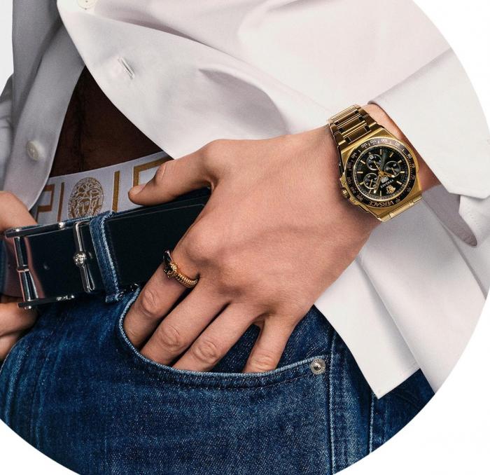 Versace Greca Extreme chronograph watch worn on wrist with gold-tone case and black dial