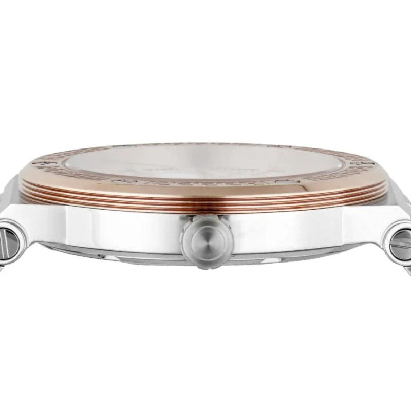 Close-up detail of Versace watch rose gold bezel with Greca pattern and stainless steel case