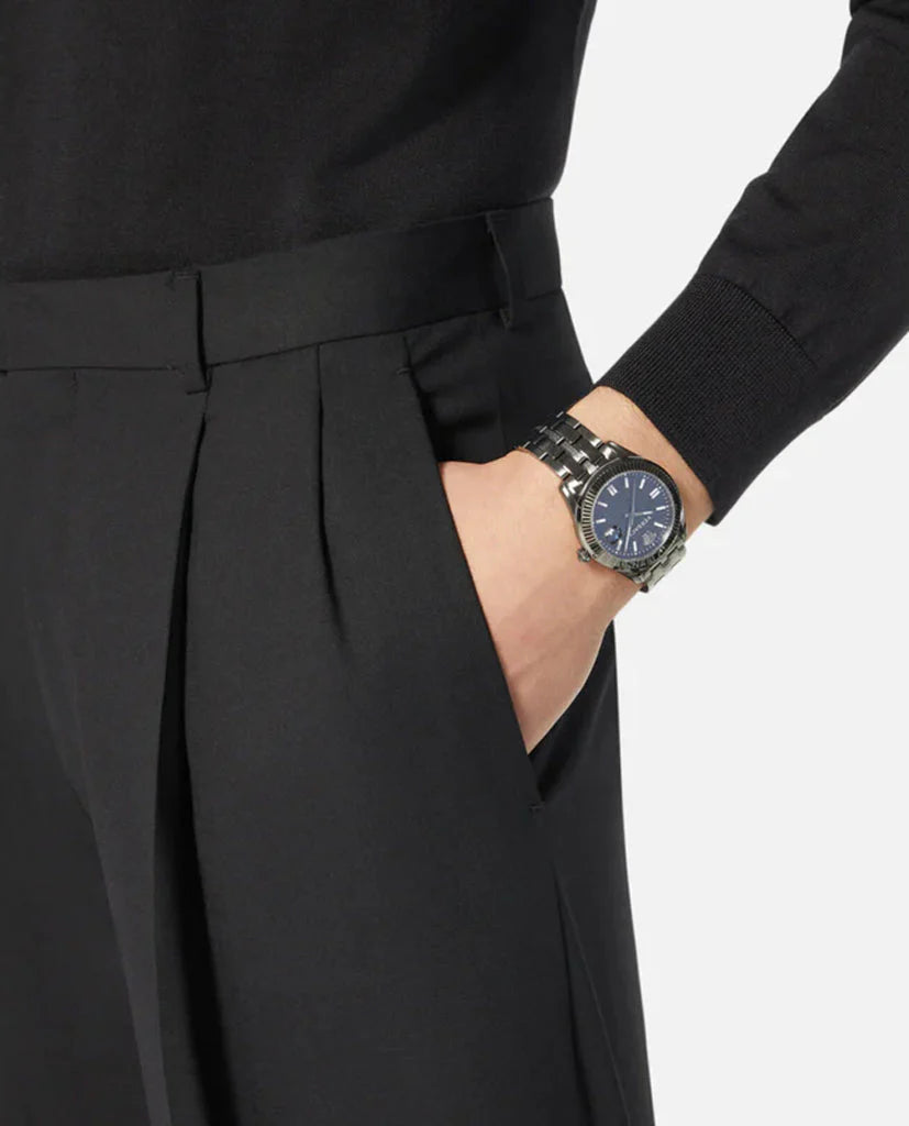 Versace Greca Time watch worn on wrist with black dial visible