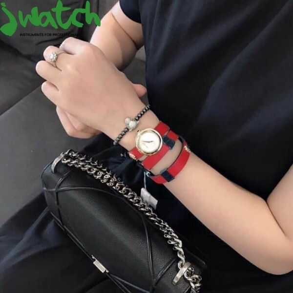 Versace V-Flare watch styled on wrist with silver dial and wrapped leather strap