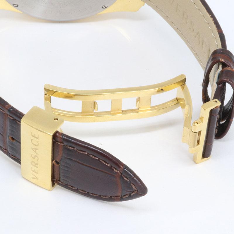 Versace V-Ray watch strap detail showing gold-tone clasp and brown crocodile-textured leather band