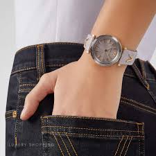 Versace V-Twist ladies watch worn on wrist with light pink leather strap