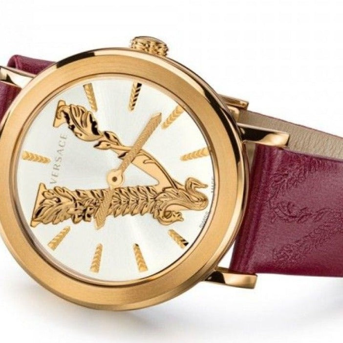 Side angle view of Versace watch showing gold case and maroon leather strap