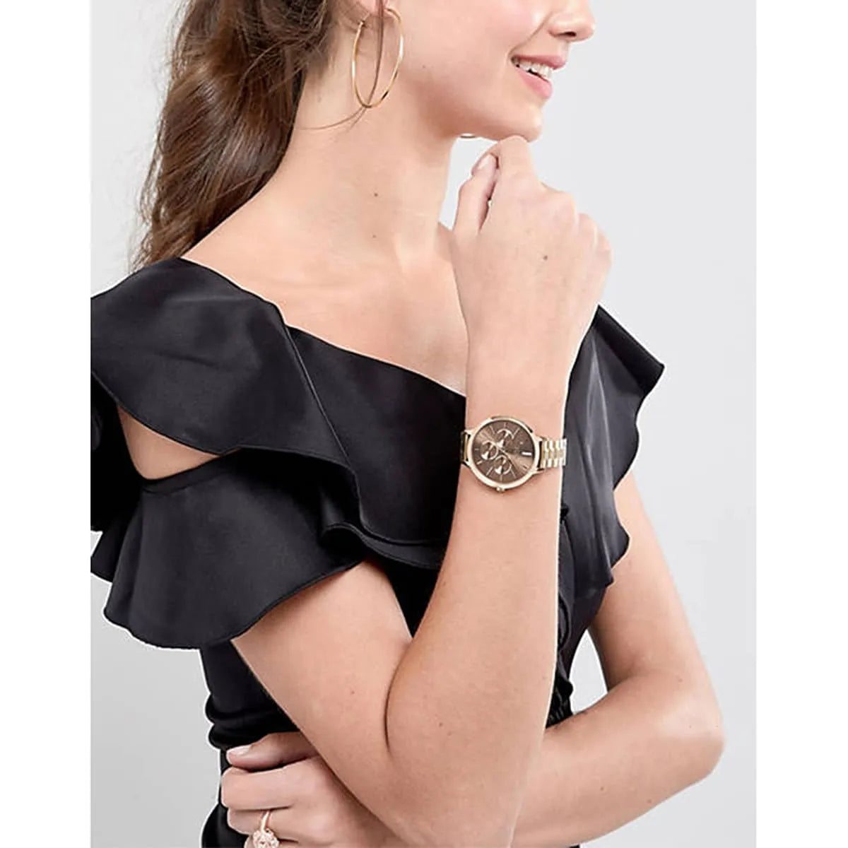 Hugo Boss Symphony ladies watch worn on wrist with brown dial and gold-tone bracelet