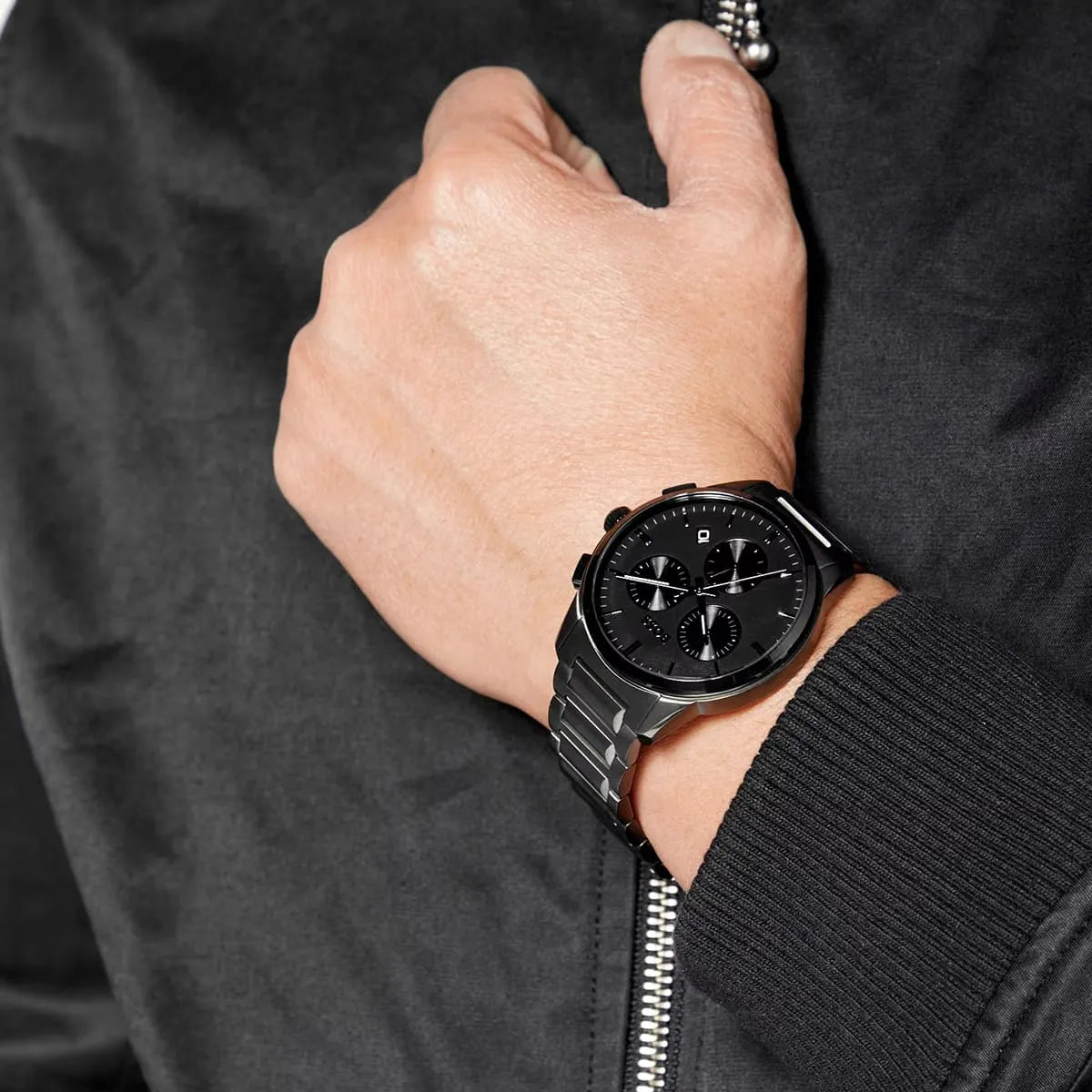 Hugo Boss Dapper watch on wrist, showing gunmetal finish and chronograph dial against black suit