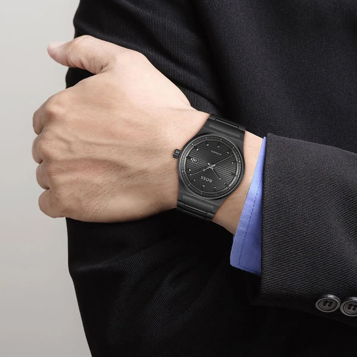 Hugo Boss Candor watch on wrist showing dial and black stainless steel bracelet
