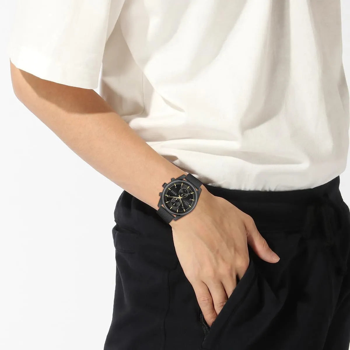 Hugo Boss Skytraveller chronograph watch worn on wrist with black dial and mesh strap