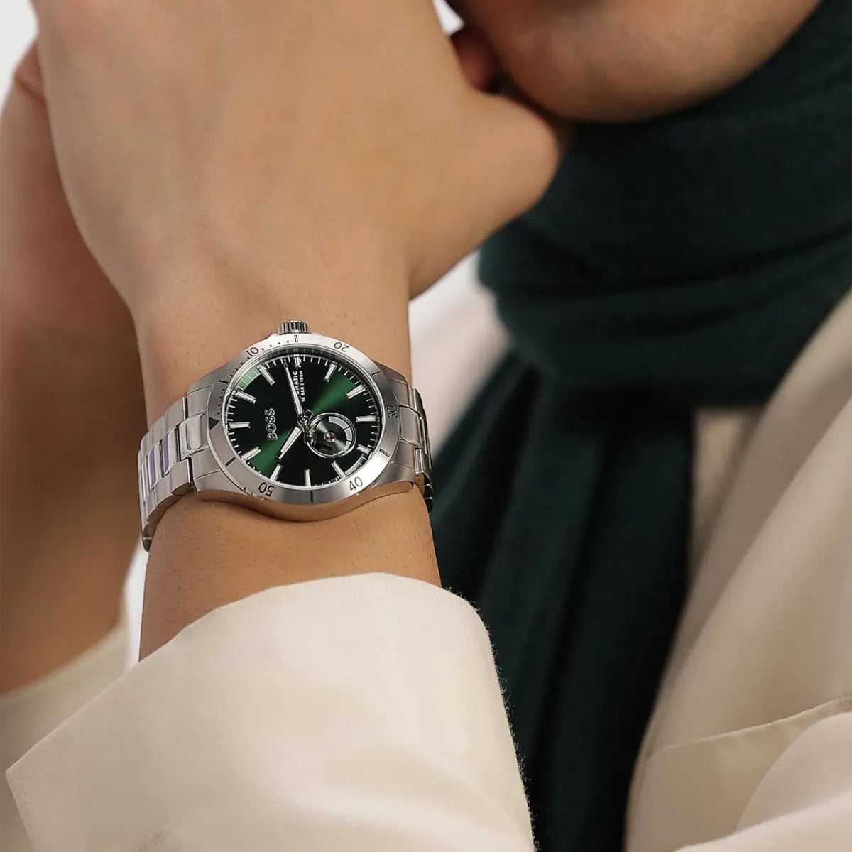 Hugo Boss Troper green dial watch worn on wrist showing dial and bracelet