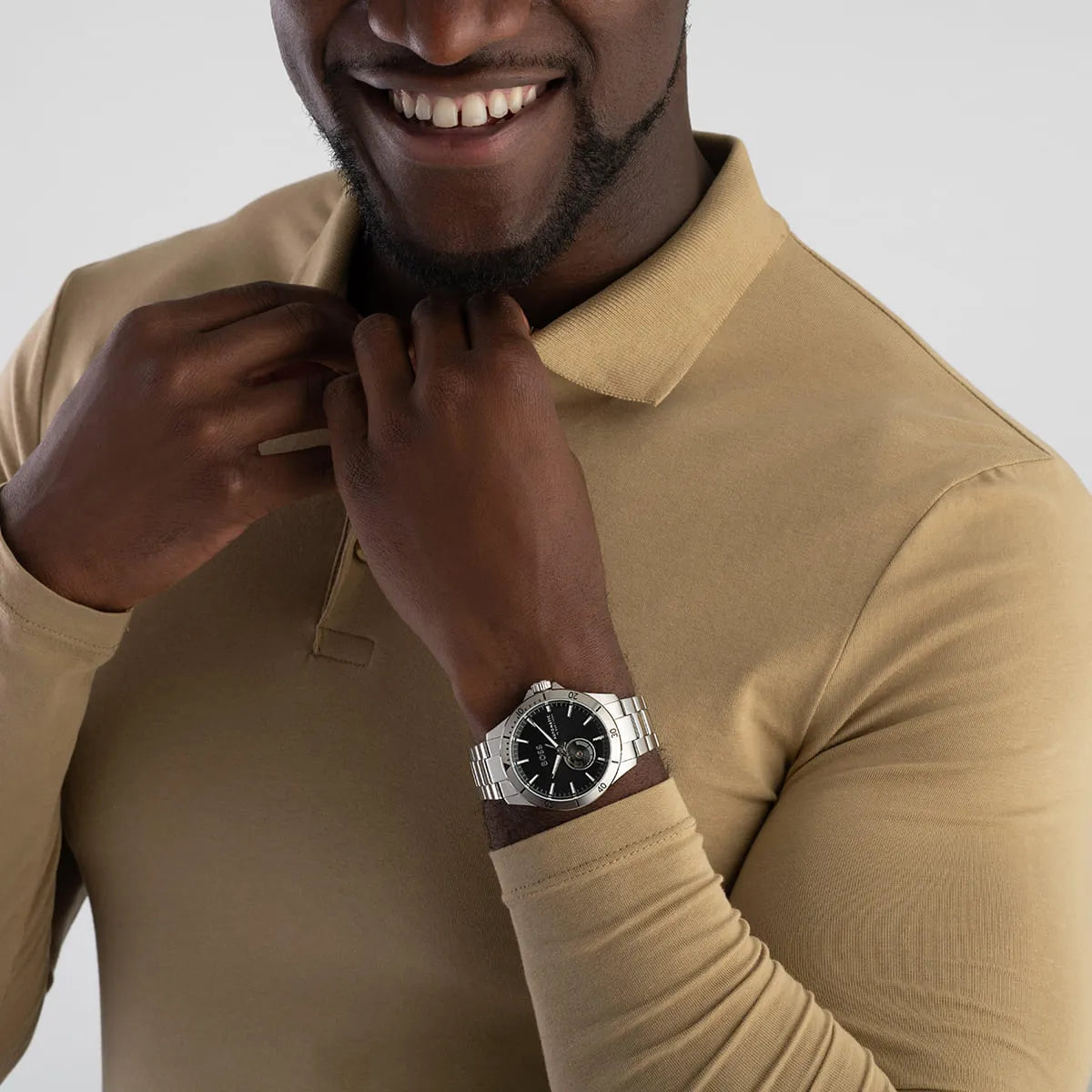 Hugo Boss Troper automatic watch on wrist with business casual outfit