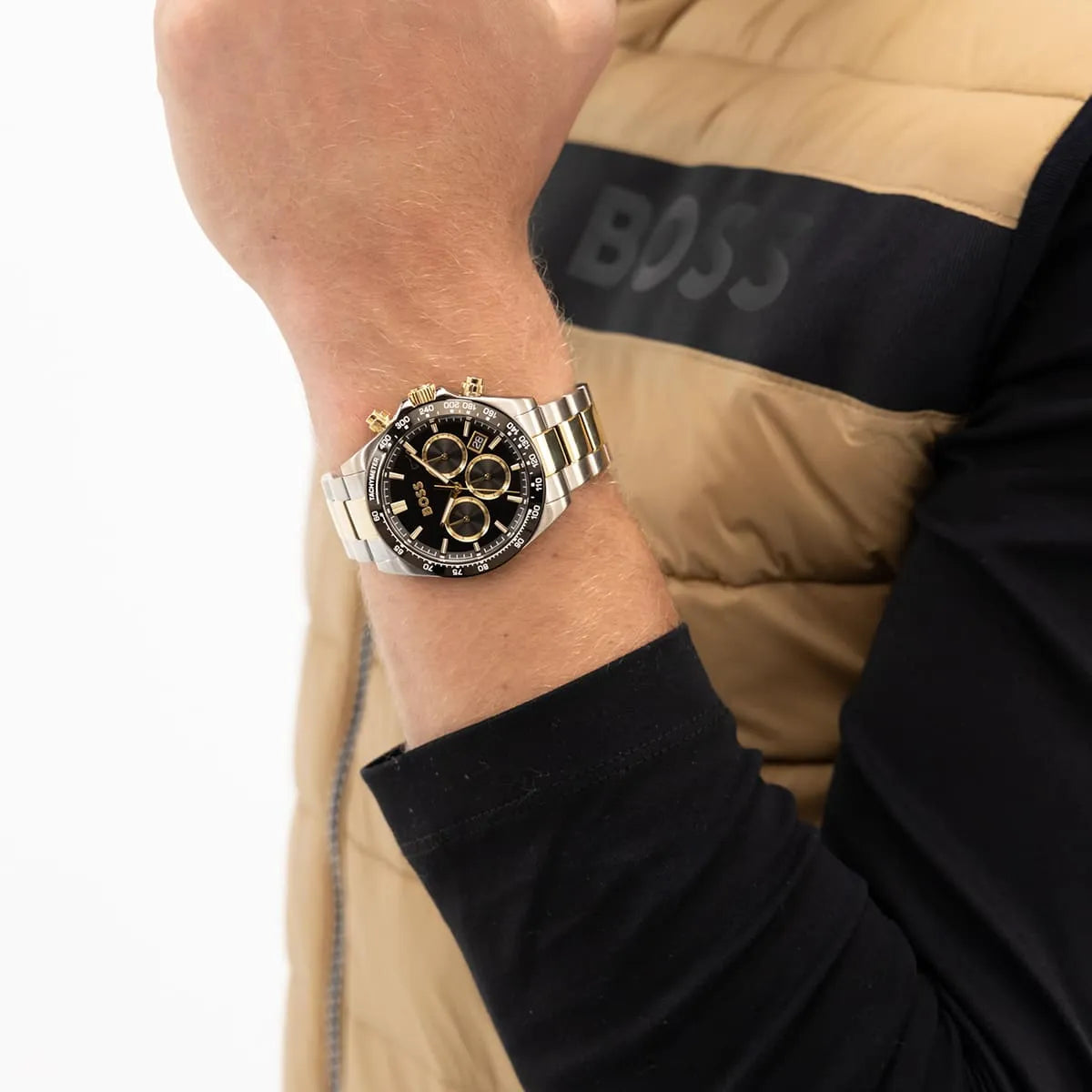 Hugo Boss chronograph watch on wrist with two-tone bracelet and black dial