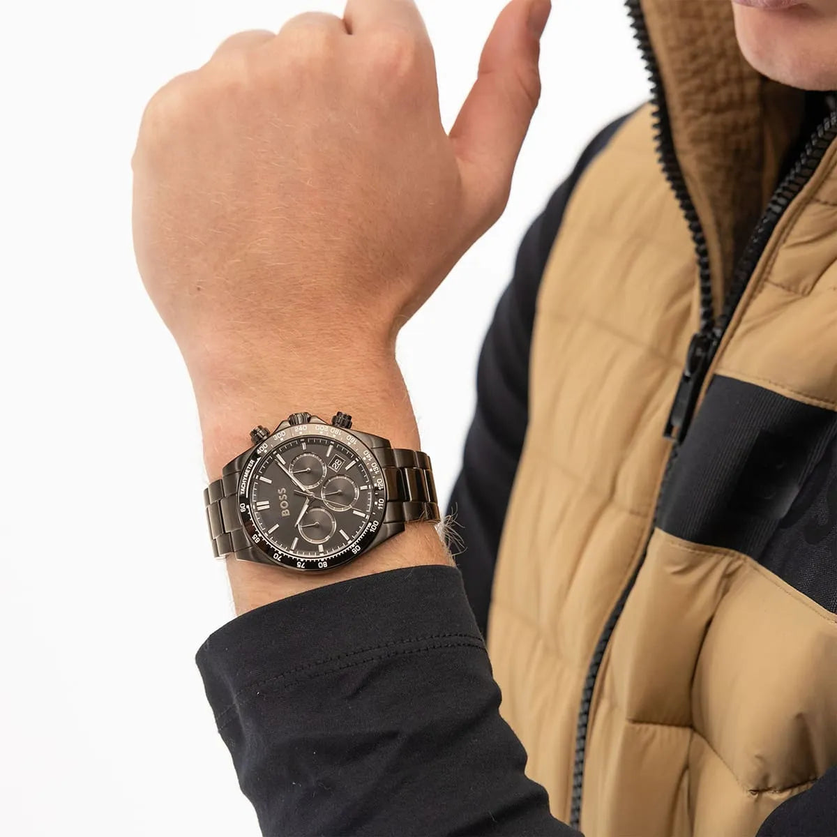 Hugo Boss black chronograph watch worn on wrist in lifestyle setting