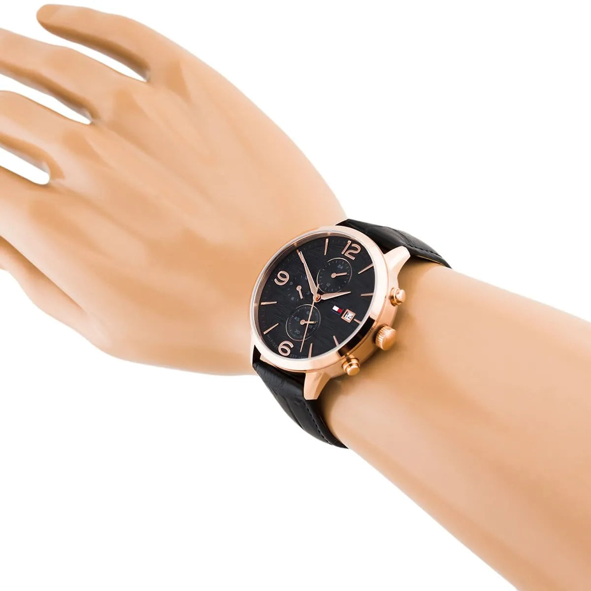 Tommy Hilfiger chronograph watch worn on wrist showing black dial and leather strap