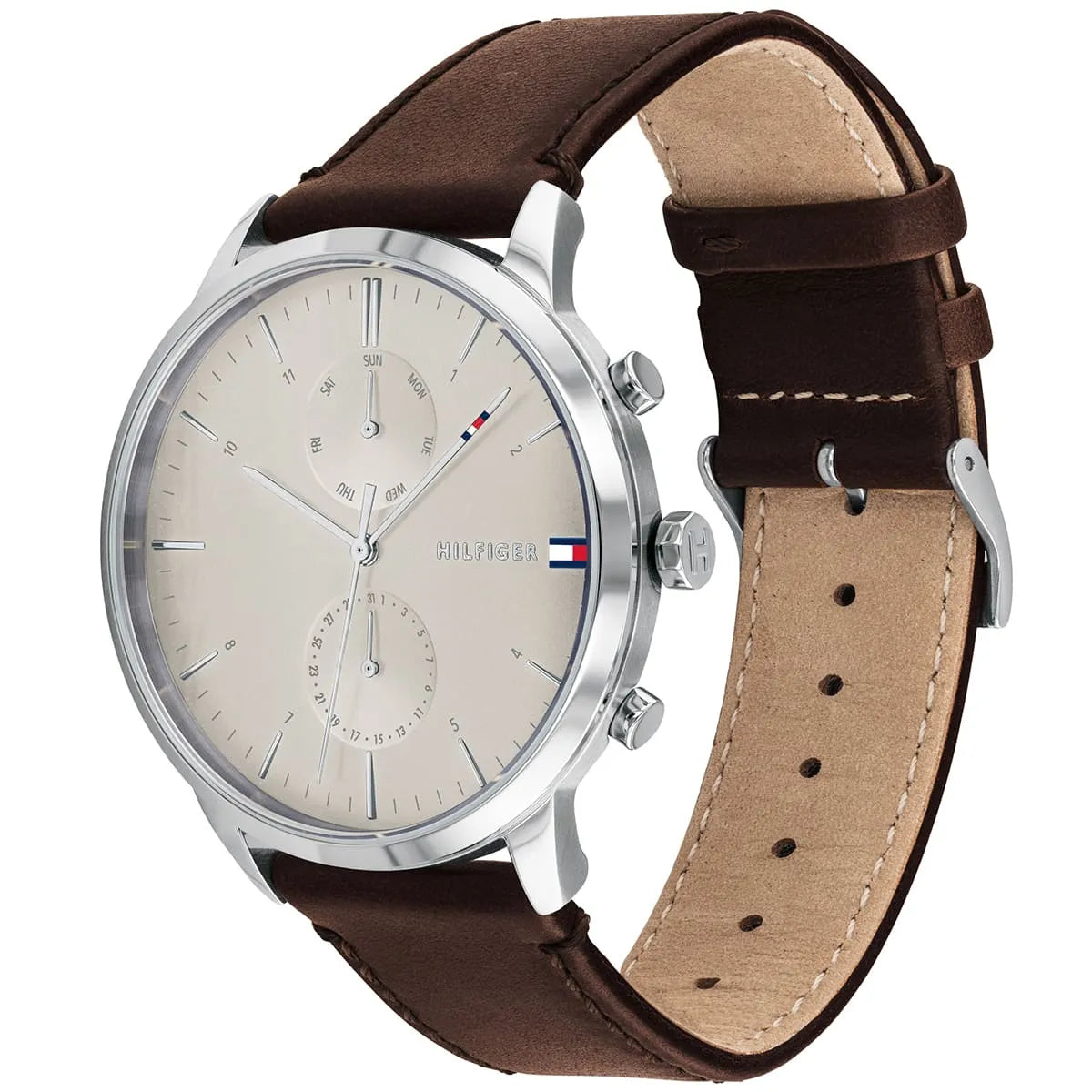 Tommy Hilfiger men's watch worn on wrist displaying cream chronograph dial and brown strap