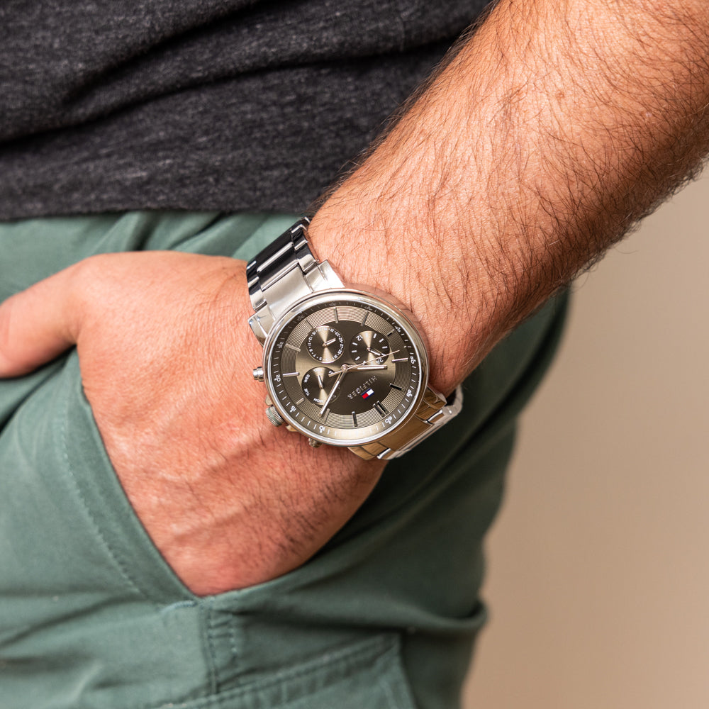 Tommy Hilfiger Tyson chronograph watch worn on wrist showing green dial with subdials
