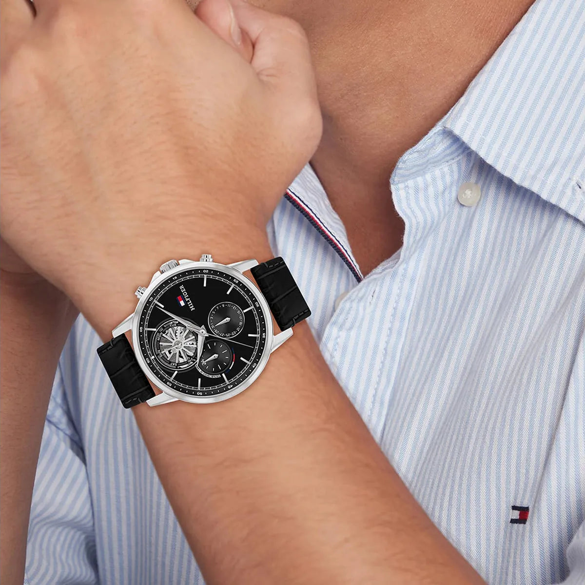 Tommy Hilfiger Stewart chronograph watch worn on wrist with formal shirt sleeve visible