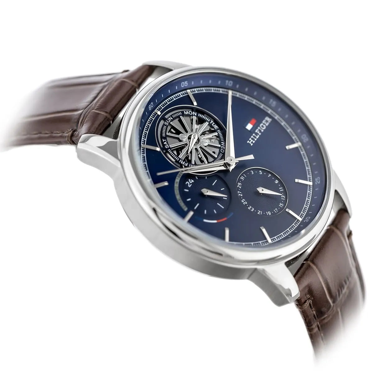 Tommy Hilfiger Stewart men's multifunction watch at angle with navy dial and brown strap