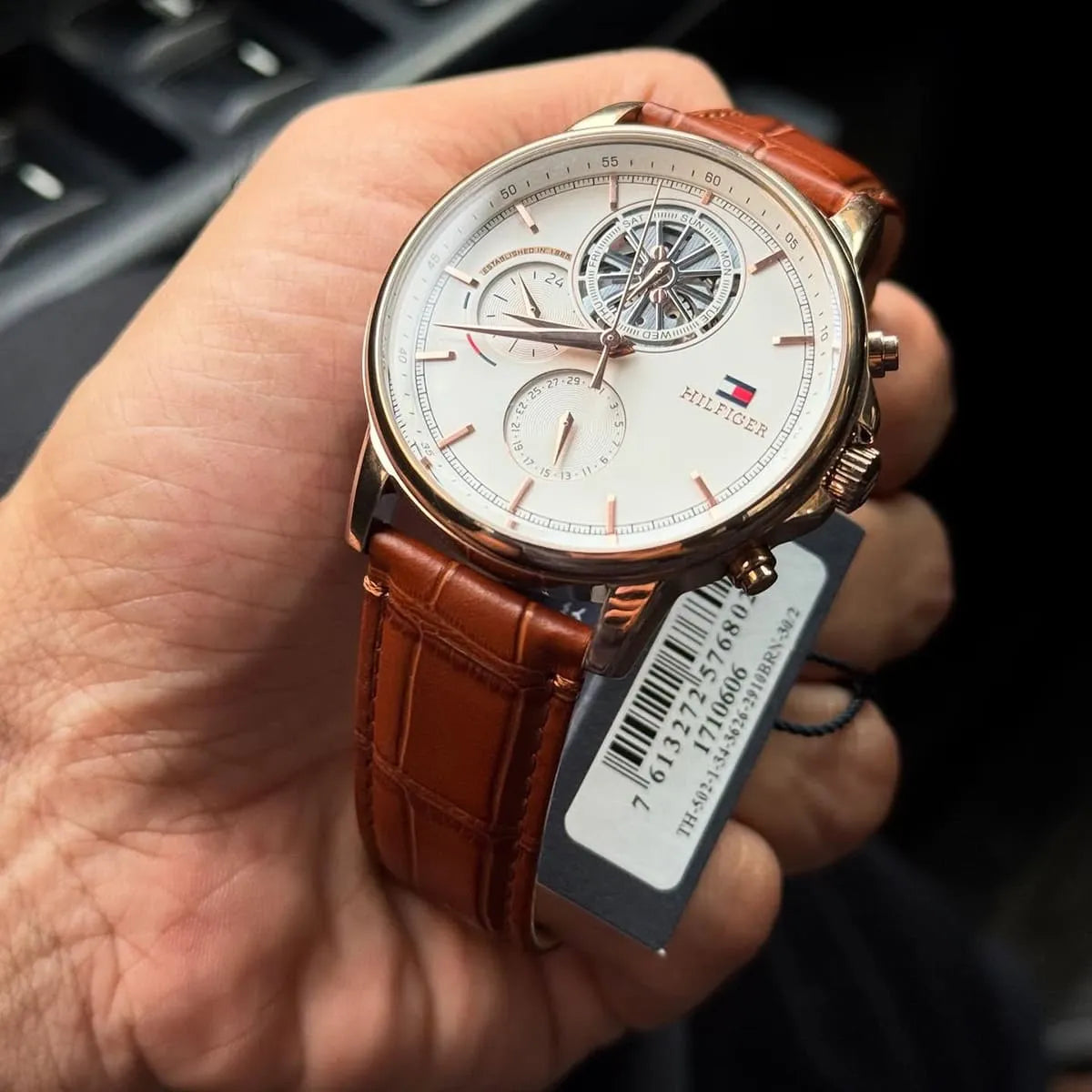 Tommy Hilfiger STANCE multifunction watch worn on wrist with cream sweater